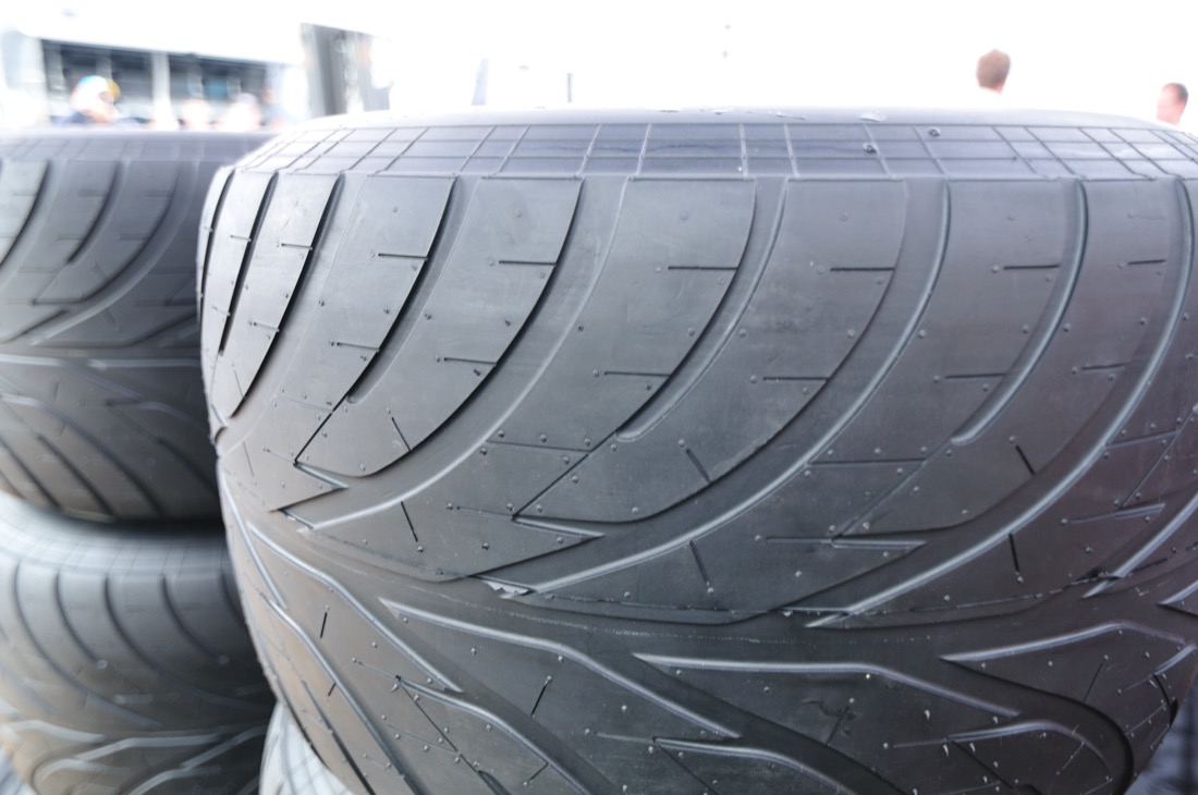 Wet-weather racing tyres showing drainage tread